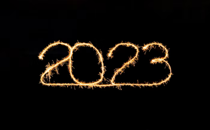 2023 on a black background. It appears to have been made with a sparkler.