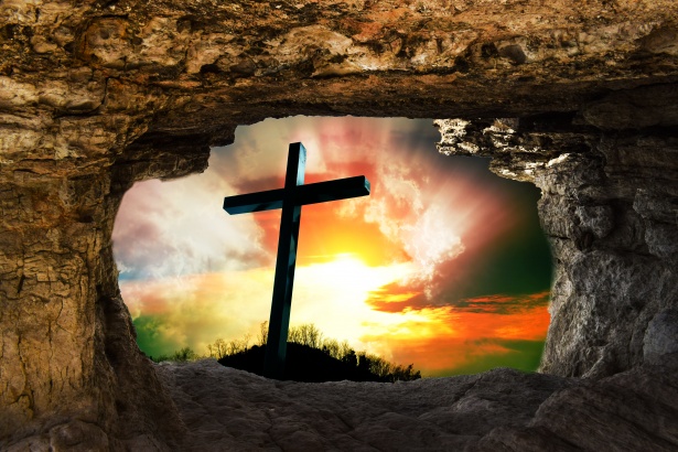 A view of a cross through a cave.