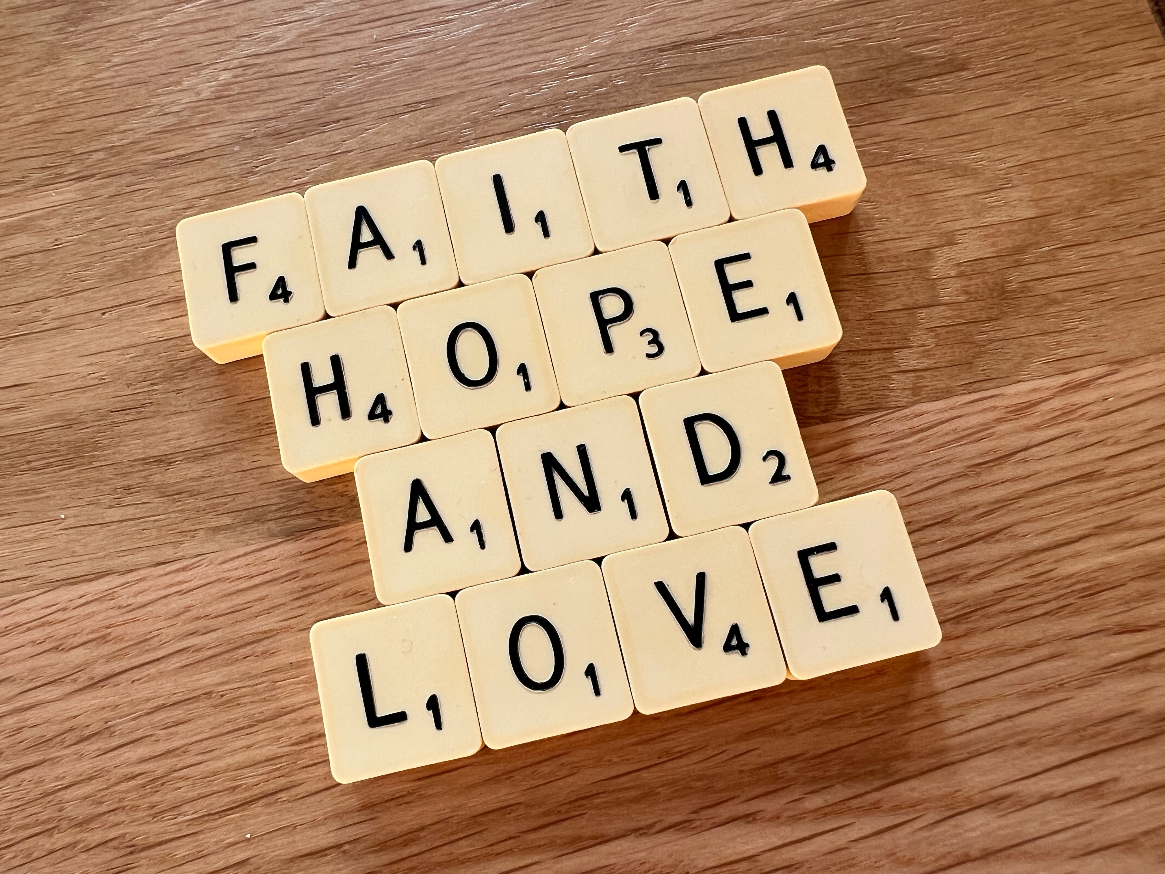 Faith, Hope and Love spelt out with scrabble letters