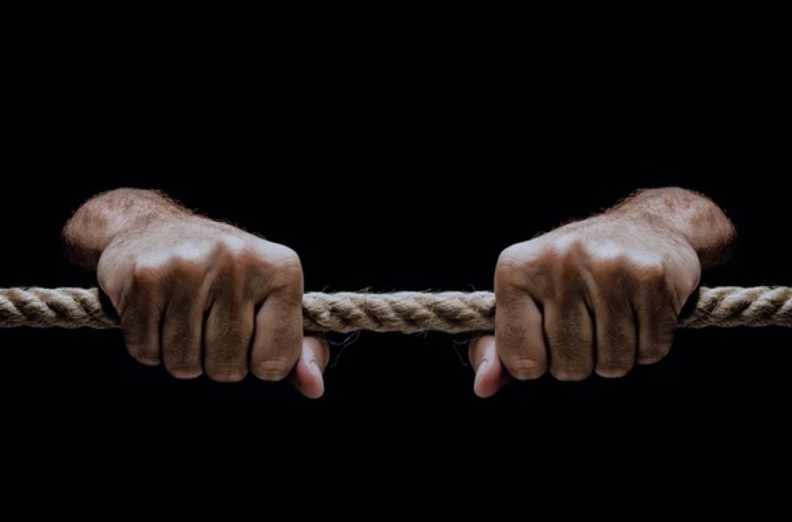 Two hands gripping a horizontal rope