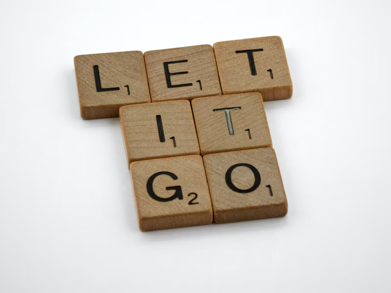 'Let it go' spelt out with wooden scrabble letters