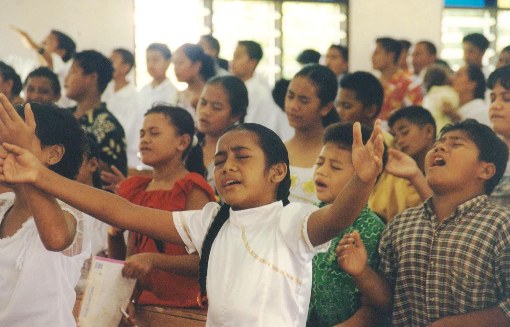 A group of Samoan kids worshiping.