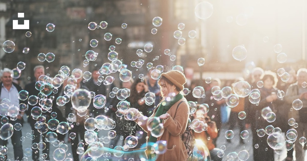 A woman stood in a clouds of bubbles